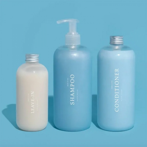 bottles of Function of Beauty shampoo, conditioner, and leave-in conditioner
