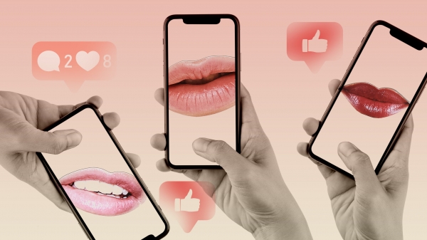Hands holding up smartphones with lips floating in the scene on a pink gradient background