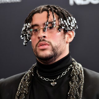 close up of bad bunny at 2020 billboard music awards in all black outfit with beaded twists